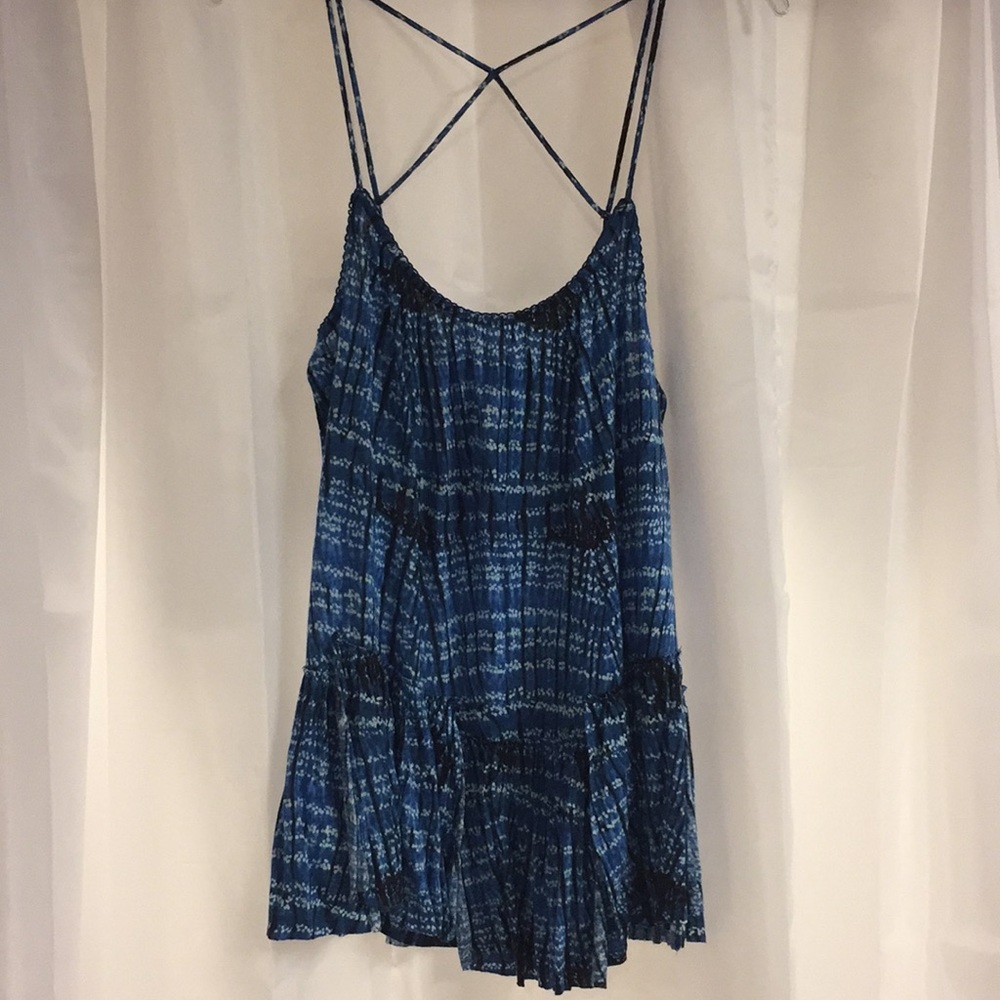 A blue tank top with ruffles at the bottom